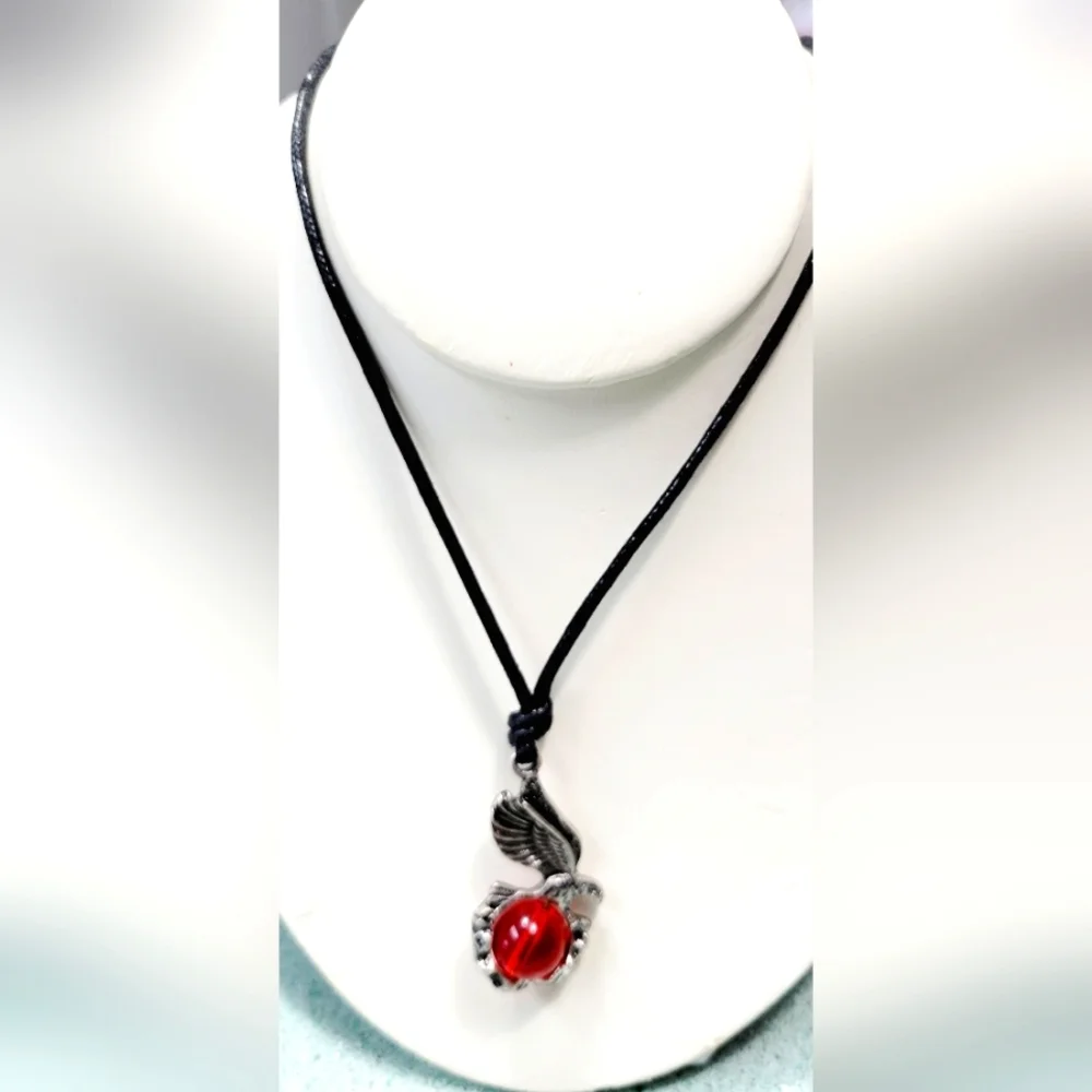 Necklace with Eagle holding a red  glass orb